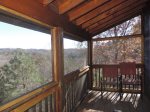 French doors lead to Screened in Deck with Long Range view with chairs